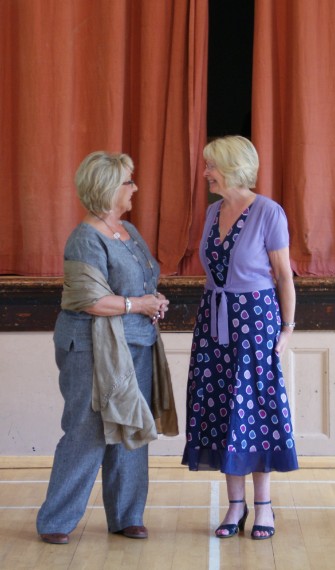 Singing students Heta Lumsden and Linda Taylor preparing to perform The Flower Duet 